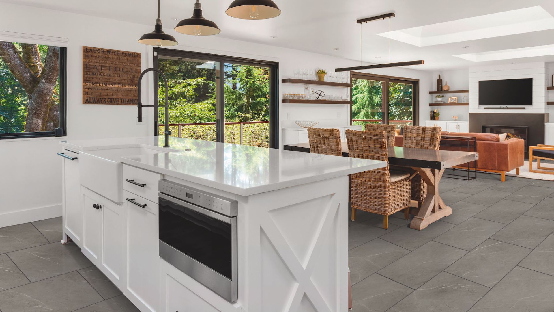 oversized gray luxury vinyl tile floors in a bright and open kitchen and living room